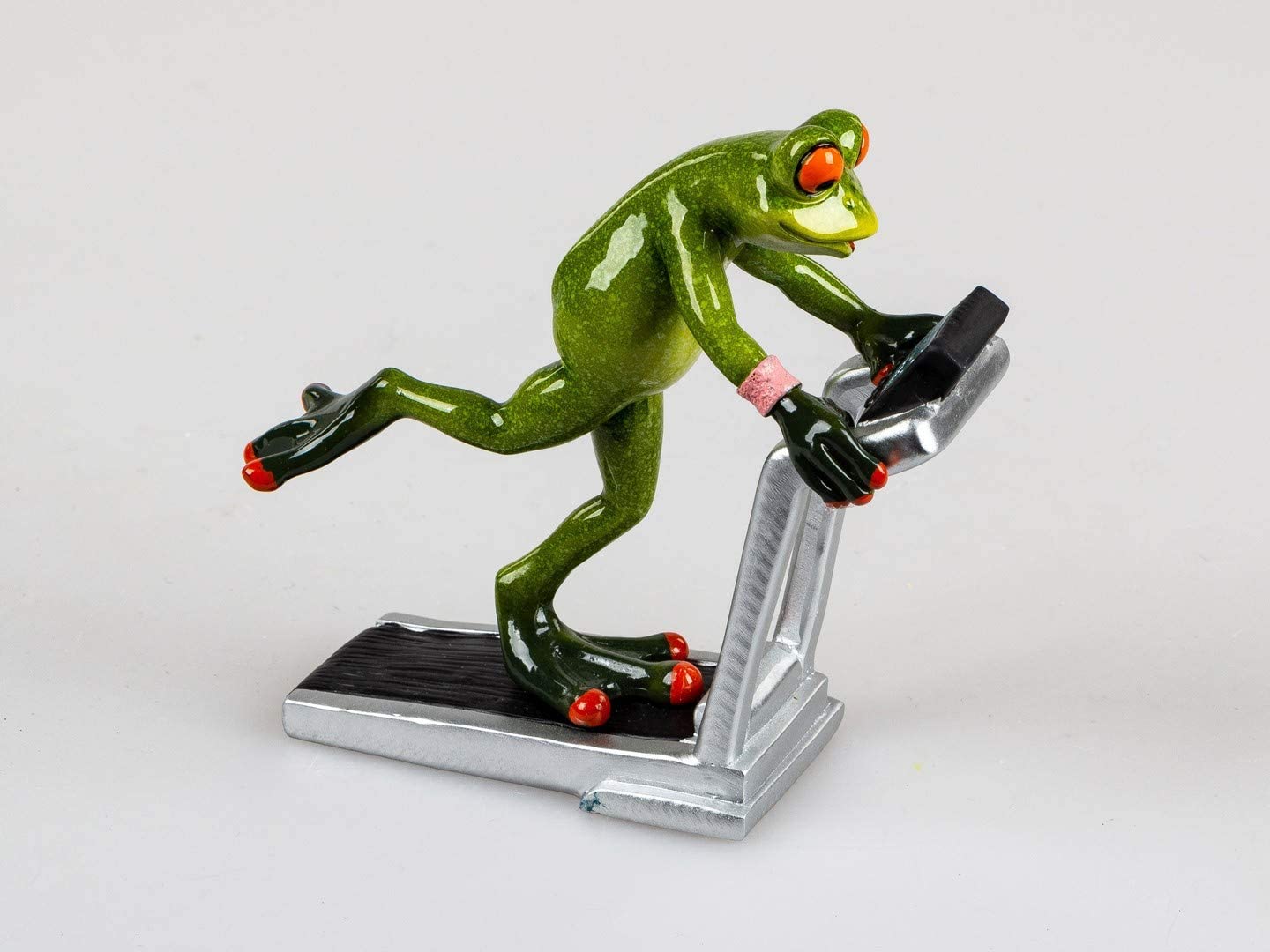 ITRR Frog Figurine on Treadmill, approx. 16 x 15 cm.