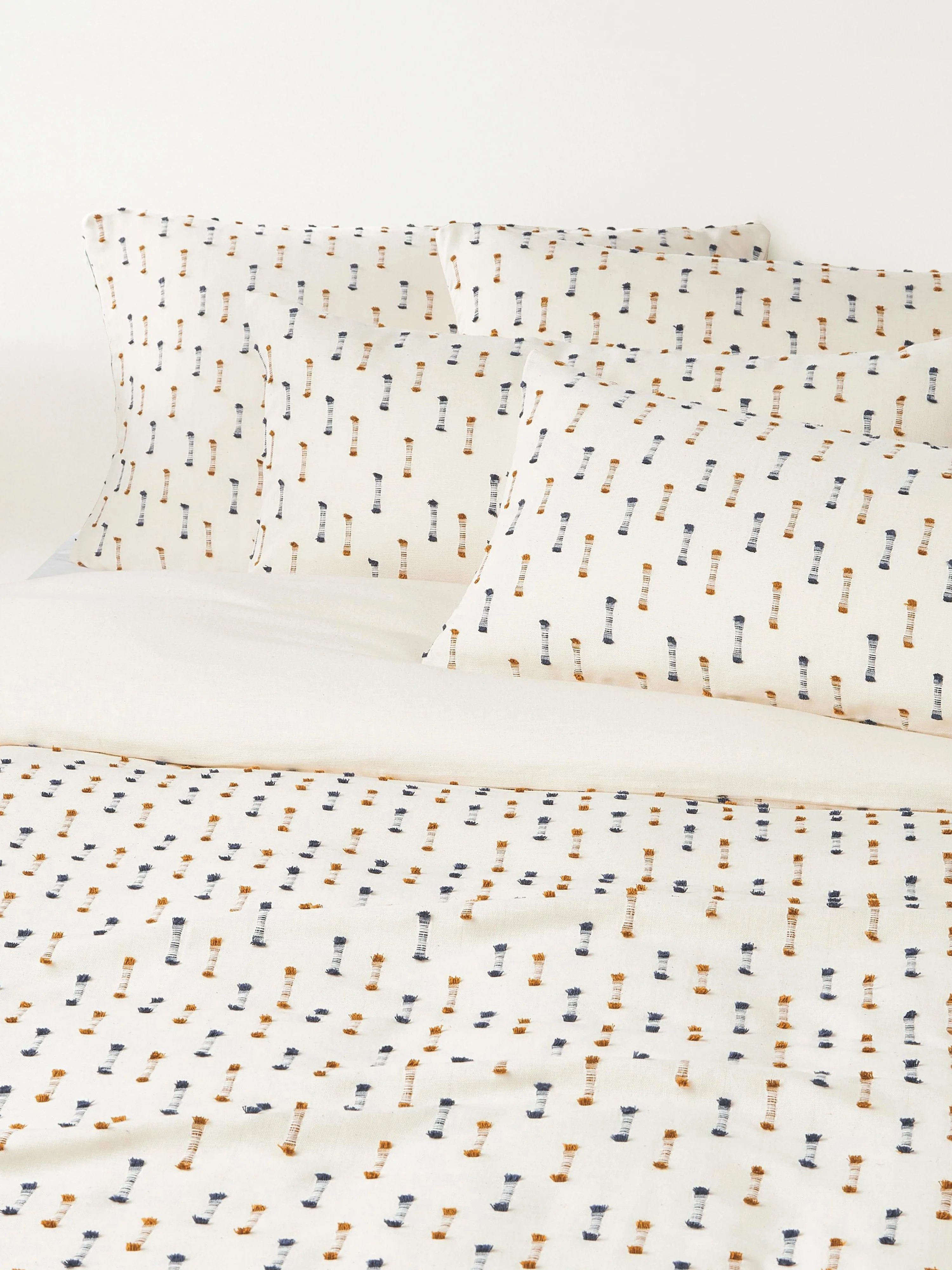 Westwing Collection Lenja cotton duvet cover with tufted fringes, Cream white, dark blue, light brown