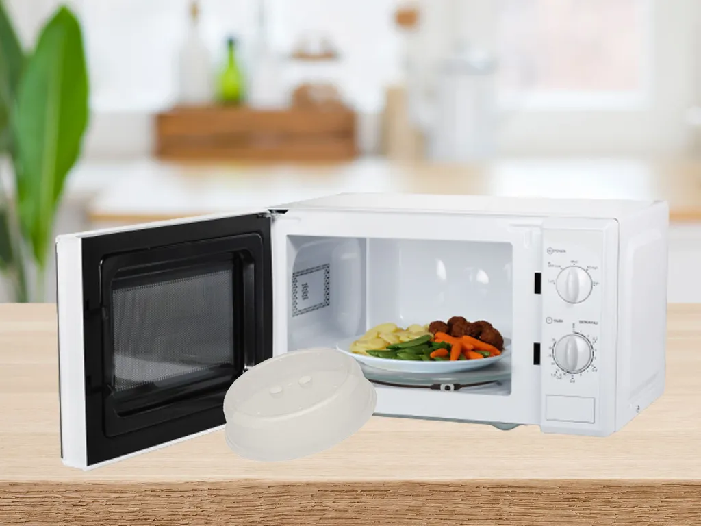 Tristar Haushaltsgeräte Microwave with timer, turntable, defrost function, end signal, 20L, 700W, and cover.